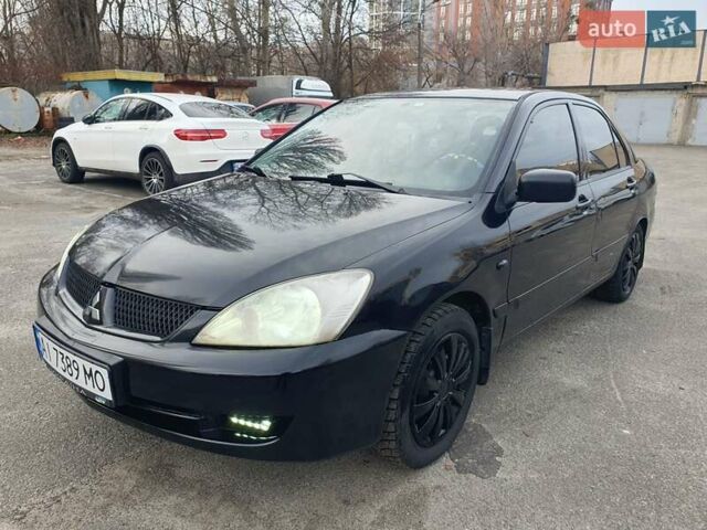 Черный Мицубиси Лансер, объемом двигателя 1.58 л и пробегом 222 тыс. км за 2999 $, фото 1 на Automoto.ua