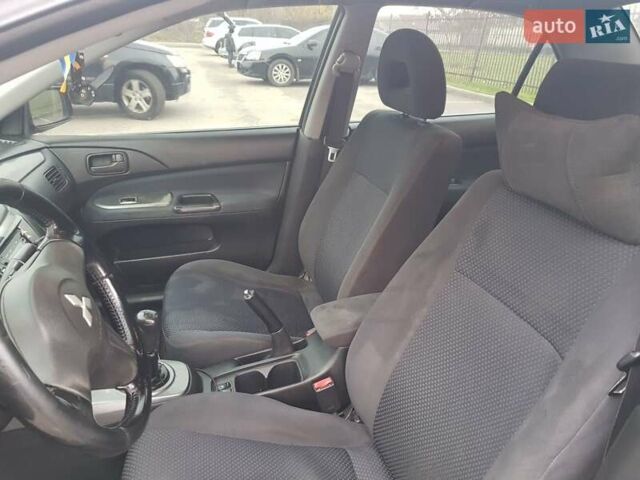 Чорний Міцубісі Lancer, об'ємом двигуна 1.58 л та пробігом 290 тис. км за 3200 $, фото 17 на Automoto.ua