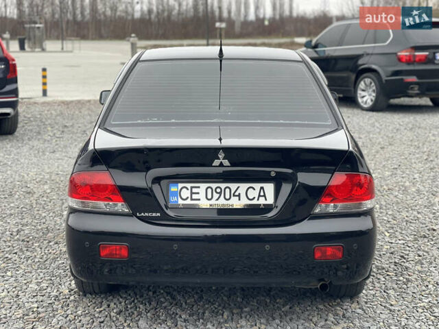 Чорний Міцубісі Lancer, об'ємом двигуна 1.58 л та пробігом 230 тис. км за 3350 $, фото 9 на Automoto.ua