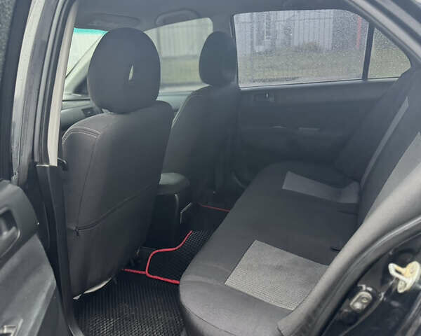 Черный Мицубиси Лансер, объемом двигателя 1.6 л и пробегом 368 тыс. км за 3200 $, фото 9 на Automoto.ua