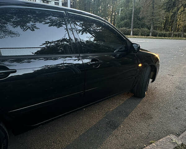 Черный Мицубиси Лансер, объемом двигателя 1.6 л и пробегом 233 тыс. км за 3650 $, фото 6 на Automoto.ua