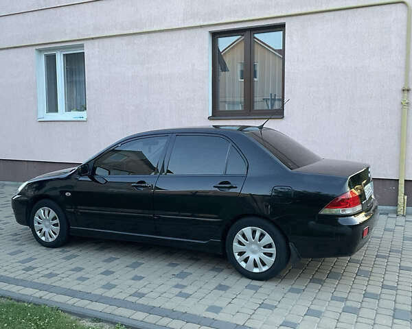 Чорний Міцубісі Lancer, об'ємом двигуна 1.6 л та пробігом 170 тис. км за 4900 $, фото 1 на Automoto.ua
