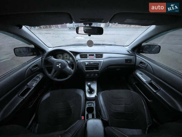 Чорний Міцубісі Lancer, об'ємом двигуна 1.58 л та пробігом 196 тис. км за 3800 $, фото 20 на Automoto.ua