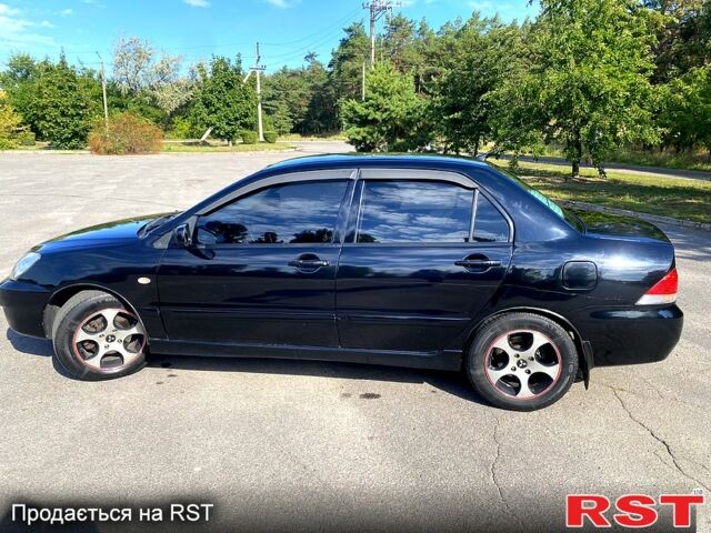 Чорний Міцубісі Lancer, об'ємом двигуна 1.6 л та пробігом 244 тис. км за 4100 $, фото 3 на Automoto.ua