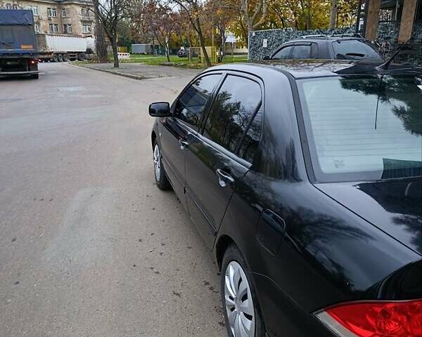 Чорний Міцубісі Lancer, об'ємом двигуна 1.6 л та пробігом 218 тис. км за 4300 $, фото 6 на Automoto.ua