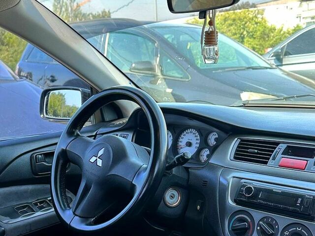 Черный Мицубиси Лансер, объемом двигателя 1.6 л и пробегом 230 тыс. км за 3200 $, фото 4 на Automoto.ua