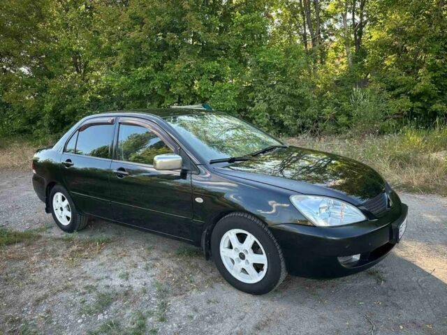 Черный Мицубиси Лансер, объемом двигателя 1.6 л и пробегом 289 тыс. км за 3200 $, фото 9 на Automoto.ua