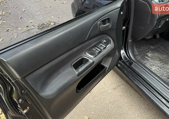 Чорний Міцубісі Lancer, об'ємом двигуна 1.58 л та пробігом 386 тис. км за 4450 $, фото 10 на Automoto.ua