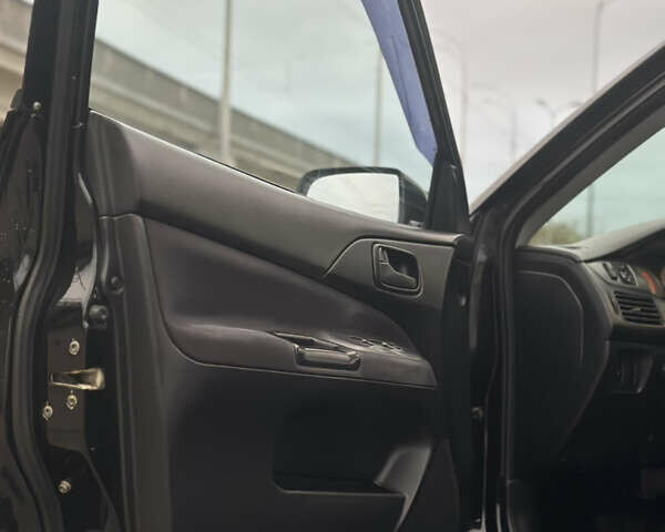 Чорний Міцубісі Lancer, об'ємом двигуна 1.58 л та пробігом 230 тис. км за 4350 $, фото 11 на Automoto.ua