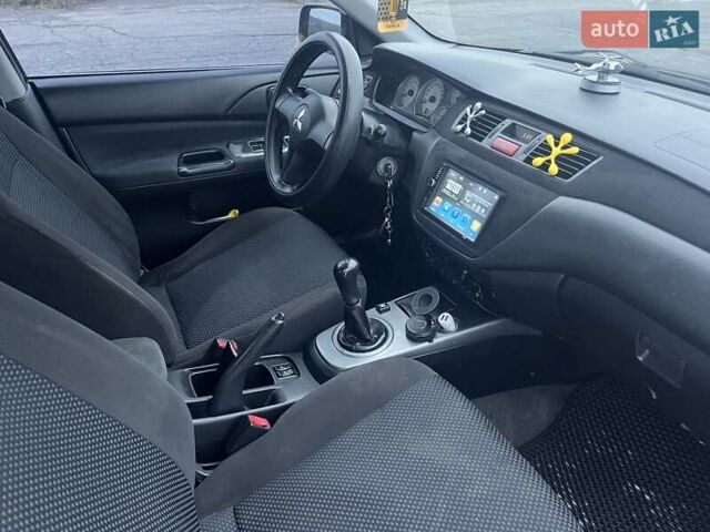 Чорний Міцубісі Lancer, об'ємом двигуна 1.58 л та пробігом 282 тис. км за 4100 $, фото 9 на Automoto.ua