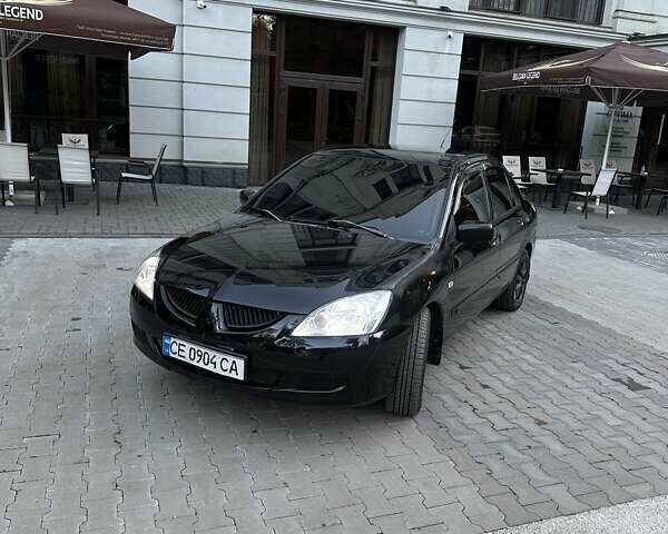 Черный Мицубиси Лансер, объемом двигателя 1.58 л и пробегом 230 тыс. км за 3800 $, фото 9 на Automoto.ua