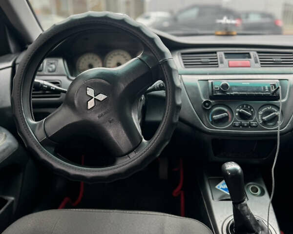 Черный Мицубиси Лансер, объемом двигателя 1.58 л и пробегом 370 тыс. км за 3500 $, фото 8 на Automoto.ua