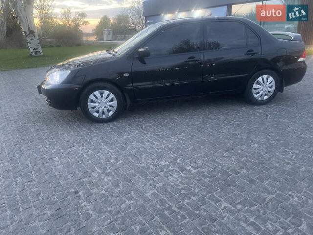 Черный Мицубиси Лансер, объемом двигателя 1.6 л и пробегом 231 тыс. км за 4250 $, фото 3 на Automoto.ua