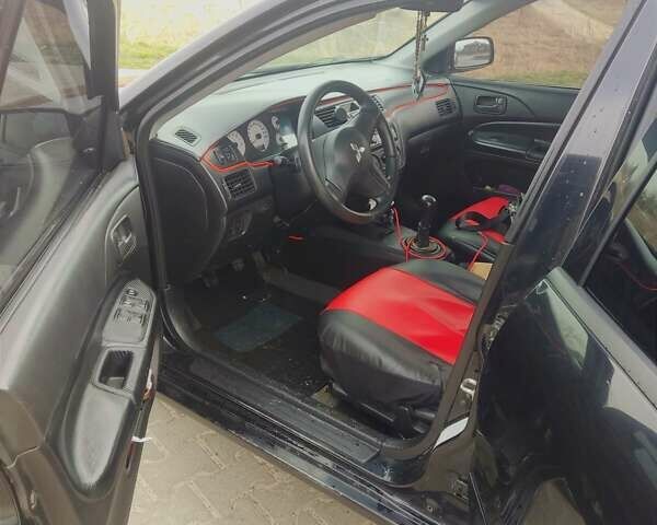 Чорний Міцубісі Lancer, об'ємом двигуна 1.6 л та пробігом 350 тис. км за 3300 $, фото 7 на Automoto.ua