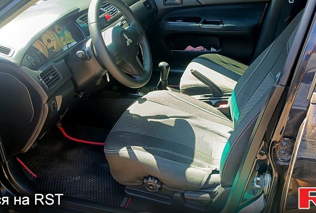 Черный Мицубиси Лансер, объемом двигателя 1.6 л и пробегом 238 тыс. км за 4300 $, фото 5 на Automoto.ua