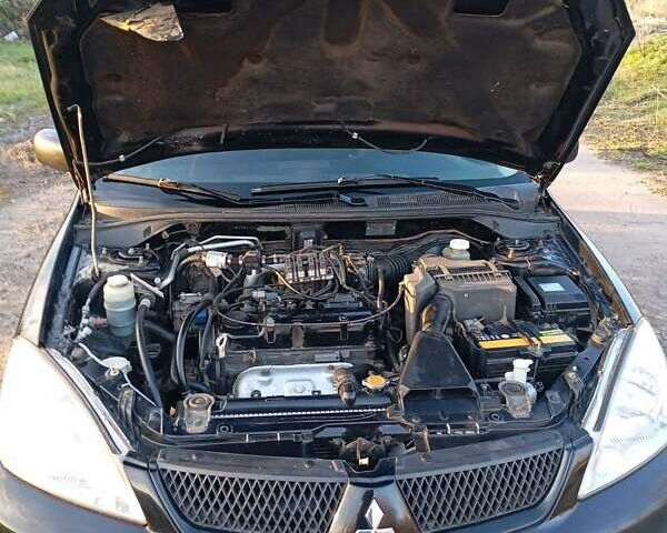 Чорний Міцубісі Lancer, об'ємом двигуна 1.6 л та пробігом 325 тис. км за 4750 $, фото 3 на Automoto.ua