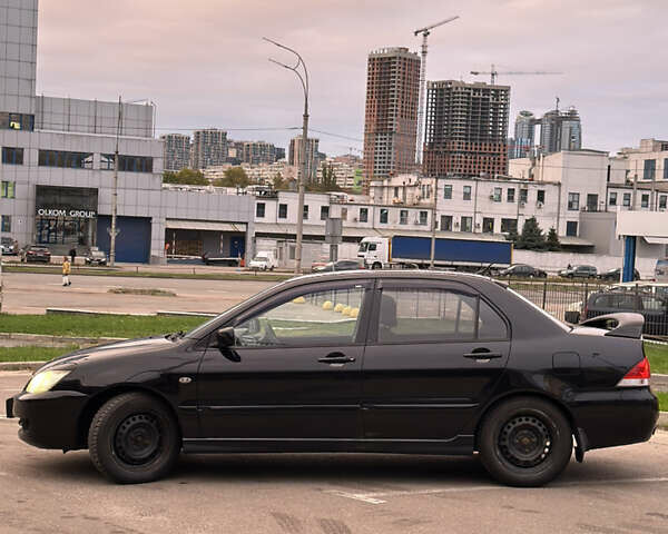 Чорний Міцубісі Lancer, об'ємом двигуна 1.58 л та пробігом 230 тис. км за 4350 $, фото 1 на Automoto.ua