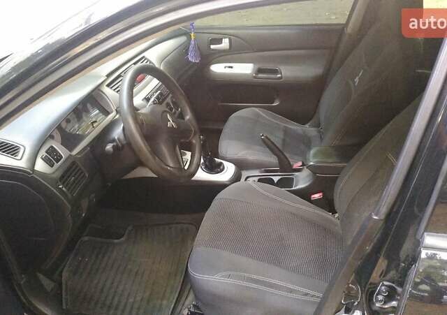 Черный Мицубиси Лансер, объемом двигателя 1.6 л и пробегом 257 тыс. км за 4500 $, фото 14 на Automoto.ua