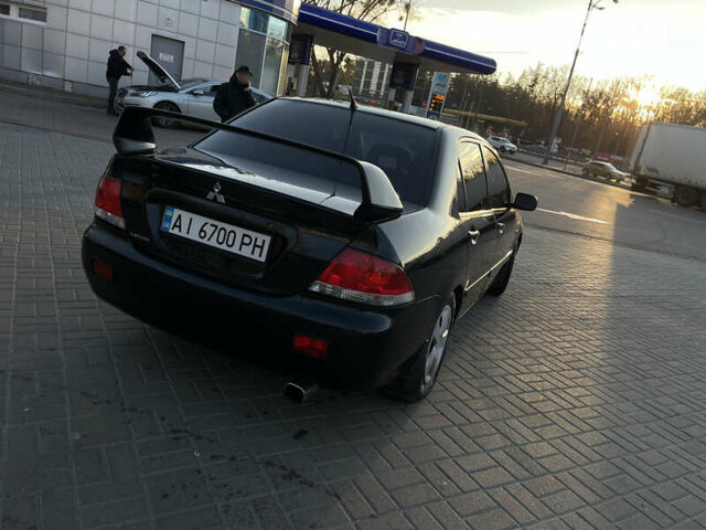 Чорний Міцубісі Lancer, об'ємом двигуна 1.58 л та пробігом 256 тис. км за 5350 $, фото 4 на Automoto.ua