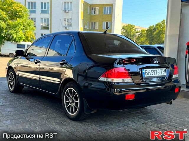 Чорний Міцубісі Lancer, об'ємом двигуна 1.6 л та пробігом 176 тис. км за 3777 $, фото 4 на Automoto.ua