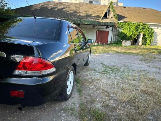 Черный Мицубиси Лансер, объемом двигателя 1.6 л и пробегом 289 тыс. км за 3200 $, фото 3 на Automoto.ua