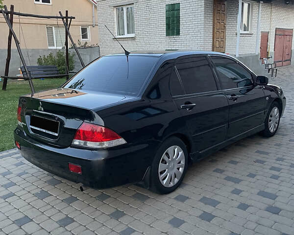 Чорний Міцубісі Lancer, об'ємом двигуна 1.6 л та пробігом 170 тис. км за 4900 $, фото 3 на Automoto.ua