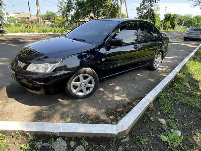 Чорний Міцубісі Lancer, об'ємом двигуна 1.6 л та пробігом 180 тис. км за 5699 $, фото 1 на Automoto.ua