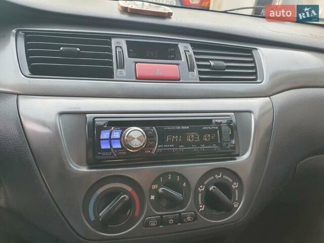 Черный Мицубиси Лансер, объемом двигателя 1.58 л и пробегом 222 тыс. км за 2999 $, фото 21 на Automoto.ua