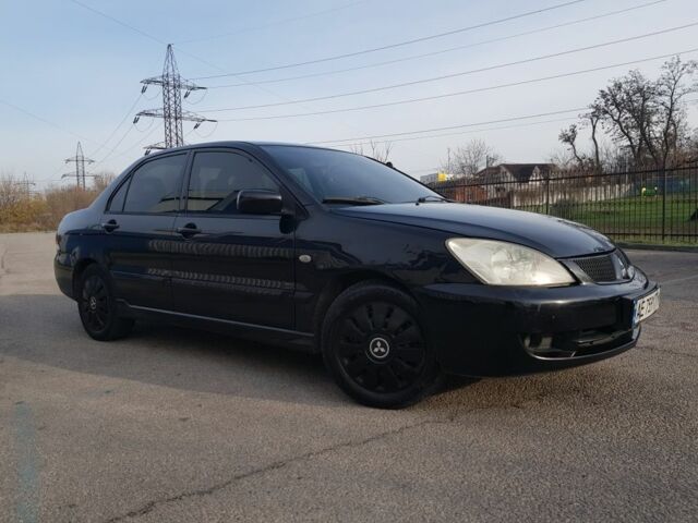 Черный Мицубиси Лансер, объемом двигателя 1.6 л и пробегом 290 тыс. км за 3200 $, фото 1 на Automoto.ua