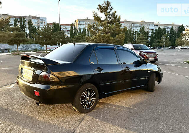 Чорний Міцубісі Lancer, об'ємом двигуна 2 л та пробігом 250 тис. км за 4999 $, фото 1 на Automoto.ua