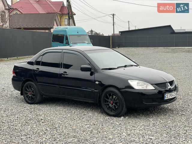 Чорний Міцубісі Lancer, об'ємом двигуна 1.58 л та пробігом 230 тис. км за 3350 $, фото 4 на Automoto.ua