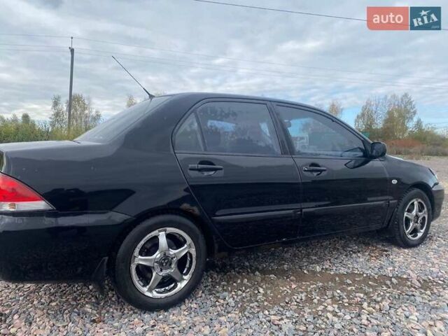 Чорний Міцубісі Lancer, об'ємом двигуна 1.6 л та пробігом 335 тис. км за 3500 $, фото 5 на Automoto.ua