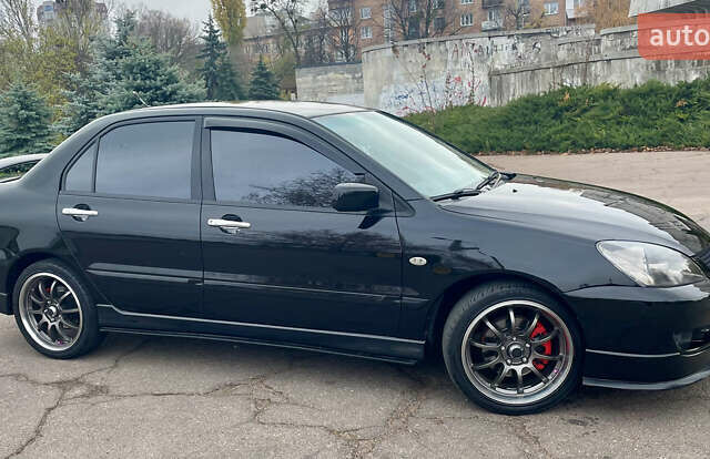 Чорний Міцубісі Lancer, об'ємом двигуна 2 л та пробігом 242 тис. км за 5900 $, фото 2 на Automoto.ua