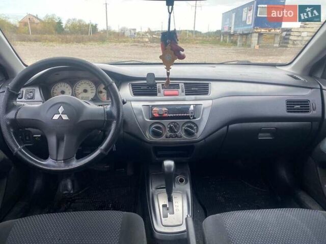 Чорний Міцубісі Lancer, об'ємом двигуна 1.6 л та пробігом 335 тис. км за 3500 $, фото 7 на Automoto.ua