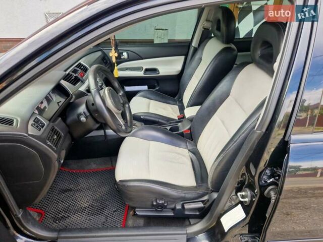 Черный Мицубиси Лансер, объемом двигателя 2 л и пробегом 168 тыс. км за 4999 $, фото 12 на Automoto.ua