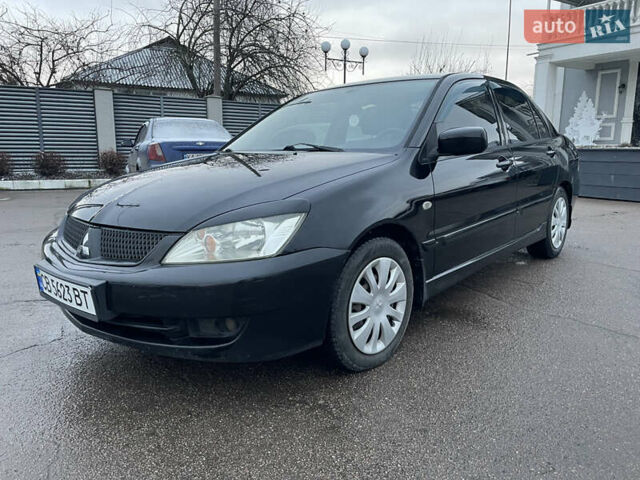Чорний Міцубісі Lancer, об'ємом двигуна 1.58 л та пробігом 196 тис. км за 3800 $, фото 1 на Automoto.ua