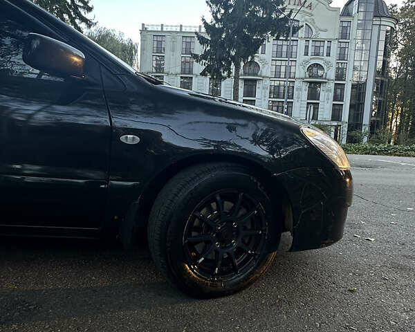 Черный Мицубиси Лансер, объемом двигателя 1.6 л и пробегом 233 тыс. км за 3650 $, фото 7 на Automoto.ua