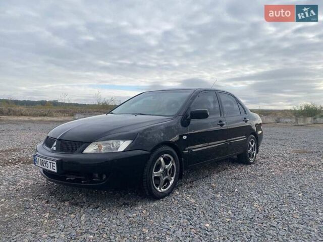 Чорний Міцубісі Lancer, об'ємом двигуна 1.6 л та пробігом 335 тис. км за 3500 $, фото 11 на Automoto.ua