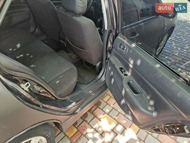 Чорний Міцубісі Lancer, об'ємом двигуна 1.58 л та пробігом 280 тис. км за 3950 $, фото 21 на Automoto.ua