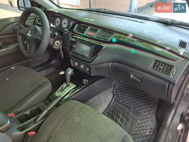 Чорний Міцубісі Lancer, об'ємом двигуна 1.58 л та пробігом 280 тис. км за 3950 $, фото 17 на Automoto.ua
