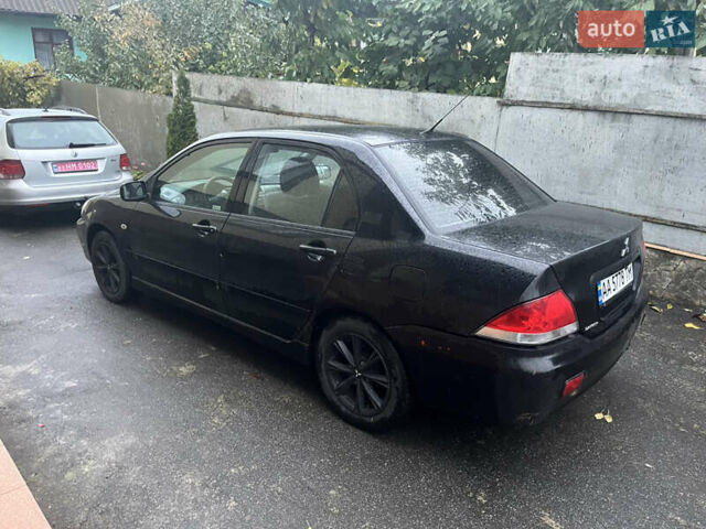 Черный Мицубиси Лансер, объемом двигателя 1.58 л и пробегом 250 тыс. км за 2450 $, фото 2 на Automoto.ua