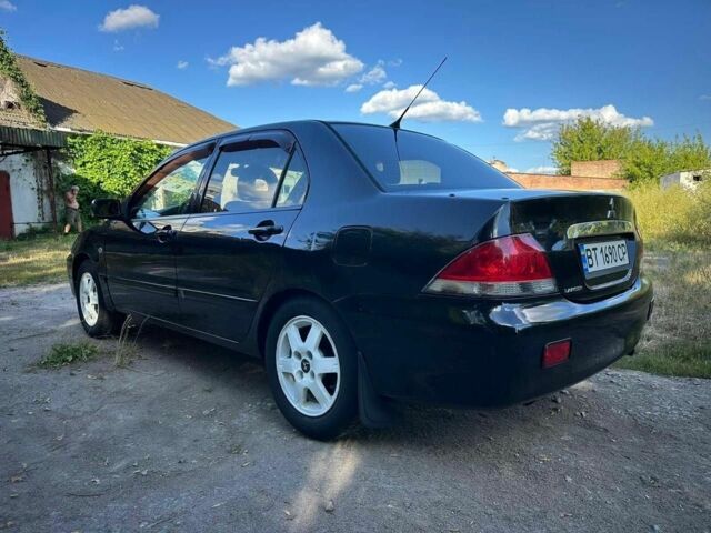 Черный Мицубиси Лансер, объемом двигателя 1.6 л и пробегом 289 тыс. км за 3200 $, фото 11 на Automoto.ua