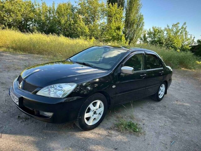 Черный Мицубиси Лансер, объемом двигателя 1.6 л и пробегом 289 тыс. км за 3200 $, фото 8 на Automoto.ua