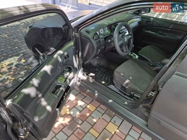 Чорний Міцубісі Lancer, об'ємом двигуна 1.58 л та пробігом 280 тис. км за 3950 $, фото 16 на Automoto.ua