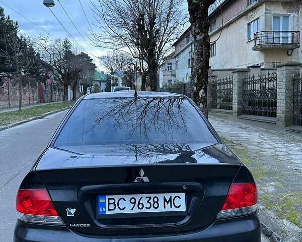 Черный Мицубиси Лансер, объемом двигателя 1.6 л и пробегом 306 тыс. км за 4800 $, фото 4 на Automoto.ua