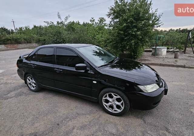 Чорний Міцубісі Lancer, об'ємом двигуна 1.6 л та пробігом 350 тис. км за 4950 $, фото 3 на Automoto.ua