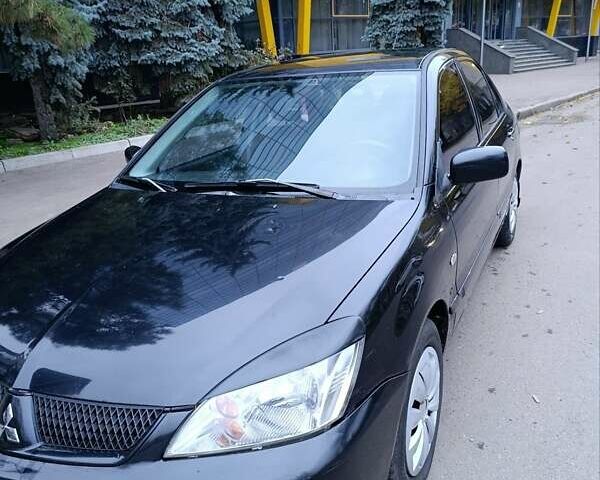 Чорний Міцубісі Lancer, об'ємом двигуна 1.6 л та пробігом 218 тис. км за 4300 $, фото 8 на Automoto.ua