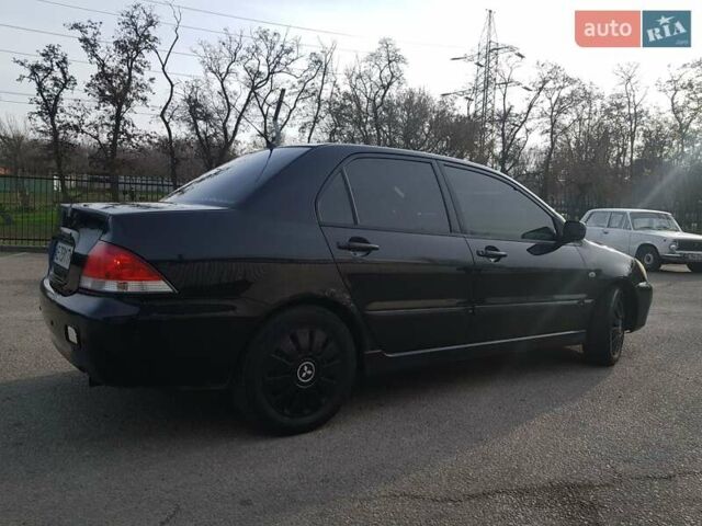 Чорний Міцубісі Lancer, об'ємом двигуна 1.58 л та пробігом 290 тис. км за 3200 $, фото 6 на Automoto.ua