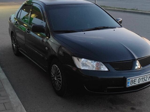 Черный Мицубиси Лансер, объемом двигателя 1.6 л и пробегом 245 тыс. км за 4100 $, фото 1 на Automoto.ua