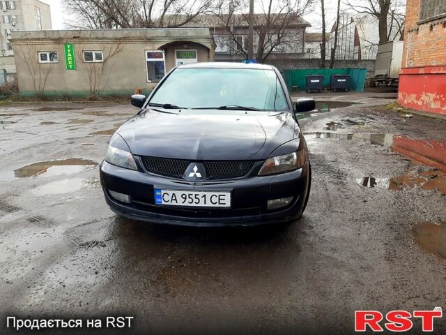 Чорний Міцубісі Lancer, об'ємом двигуна 2 л та пробігом 270 тис. км за 4900 $, фото 6 на Automoto.ua